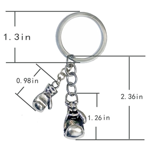 Detailed view of vintage silver boxing glove keychain with precise dimensions displayed