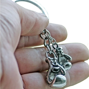 Vintage silver boxing gloves keychain with dual mini glove charms on a metal ring