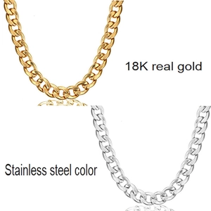 Detail view of 3.2mm flat Cuban link chain in 18K gold and stainless steel finishes