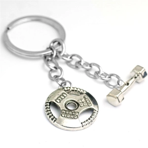 Silver metal fitness keychain with miniature dumbbell and barbell plate pendants
