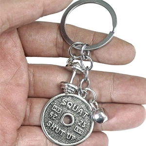 Portachiavi fitness con disco bilanciere e manubrio in metallo colore argento