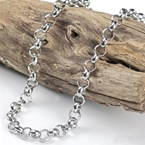 Polished stainless steel O-chain necklace draped on vintage wood for men's jewelry