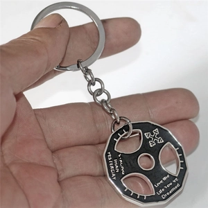 Barbell weight plate keychain with Stronger Than Yesterday motivational quote