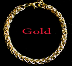 Detail of a gold braided keel chain necklace featuring a secure lobster clasp closure