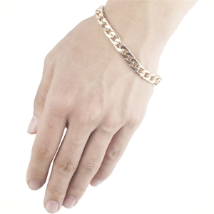 Flat NK curb link bracelet for men in golden stainless steel worn on wrist