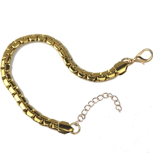 Close-up of a gold-plated stainless steel box chain bracelet with secure lobster clasp