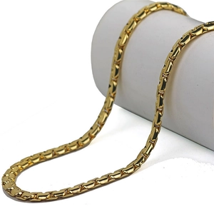 Close-up of golden stainless steel box chain showing detailed texture and metallic finish