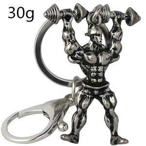 Détail du porte-clés homme musclé haltérophile avec une finition en métal gris argenté