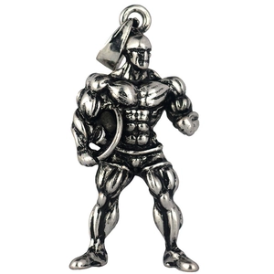 Close-up of vintage silver muscle man pendant with detailed texture and athletic design