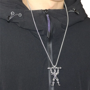 Men's silver dumbbell weightlifter pendant necklace with flat curb chain on a black hoodie