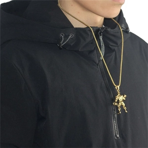 Gold dumbbell bodybuilder pendant necklace displayed on a black hoodie for men