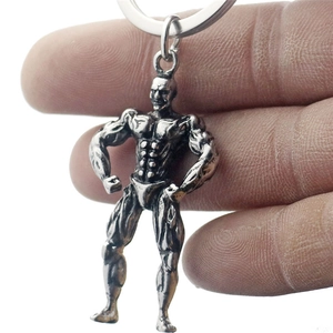 Antique silver 3D muscular bodybuilder metal keychain with detailed fitness muscles