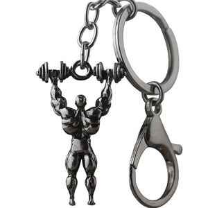 Dumbbell weightlifting keychain featuring a muscular bodybuilder pendant in antique silver