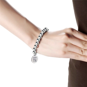 Polished titanium steel beaded bracelet with engraved Breathe Believe Be round pendant