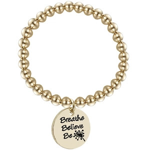Detail of gold beaded bracelet featuring a round tag with Breathe Believe Be engraving