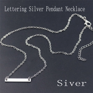 Detail view of silver bar pendant necklace with adjustable chain and lobster clasp