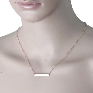 Minimalist rose gold stainless steel bar necklace on display model for Mother's Day gift