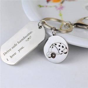 Polished stainless steel keychain engraved with Drive safe handsome quote and car charm