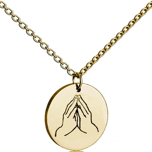 Detailed view of golden round pendant featuring engraved prayer hands on O-chain necklace