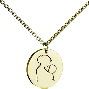 Close-up of golden round necklace pendant featuring a mother and child silhouette