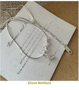 Detail of S925 silver necklace featuring a water-drop zircon and stylish snake chain