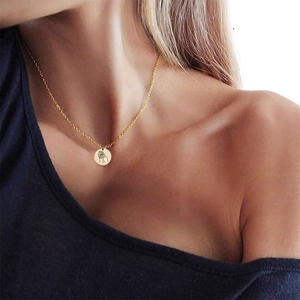 Minimalist gold stainless steel necklace with engraved hand-holding round pendant
