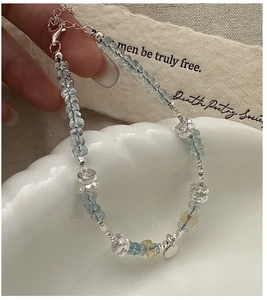 Detailed shot of S925 silver beaded bracelet with light blue aquamarine stones