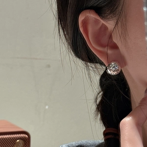 Polished 925 sterling silver faceted ball earrings with sparkling light reflection