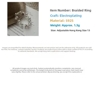 Close-up of S925 sterling silver beaded ring with white crystal and elastic band