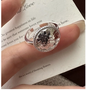 Macro detail of the hammered silver texture on this S925 sterling silver adjustable ring