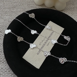 S925 sterling silver long necklace with multiple CNC textured gourd pendants on tray