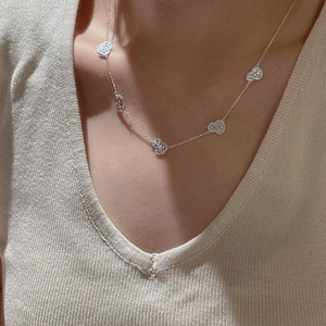 Elegant S925 sterling silver multi-heart pendant necklace on model with V-neck top