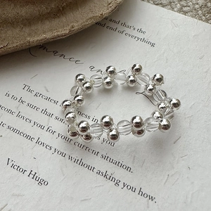 S925 sterling silver beaded ring with white crystal on vintage textured art paper