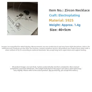 Detail of S925 sterling silver necklace with transparent line and round zircon pendant