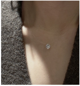 Detail of S925 silver mermaid tear necklace featuring a brilliant cut zircon on invisible line