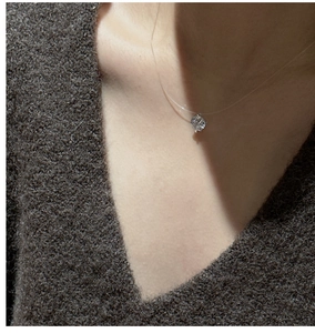 Detail of S925 silver floating necklace with zircon pendant on a clear fishing line