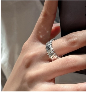Detail view of S925 sterling silver ring with crushed ice texture and beaded edges