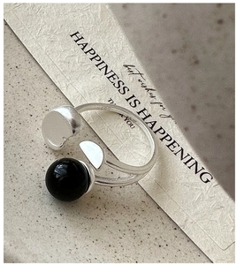 Detail shot of the S925 sterling silver stamp and round black onyx on the open ring
