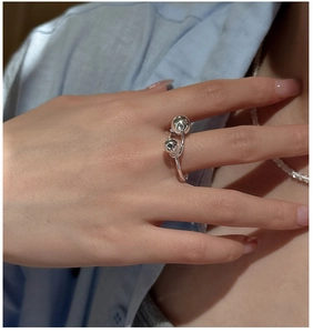Detail of S925 sterling silver ring with polished double beads on model finger