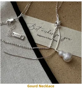 Detail of S925 sterling silver gourd necklace with AG925 stamp and textured finish