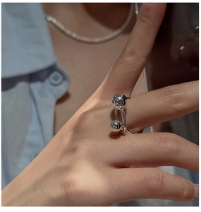 Close-up of S925 sterling silver open ring featuring industrial minimalist metal beads