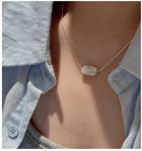 Elegant S925 silver necklace featuring a rectangular mother-of-pearl pendant on a model
