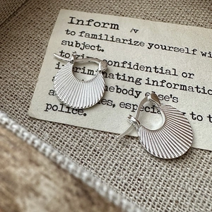 Vintage S925 sterling silver pleated texture hoop earrings on retro card board