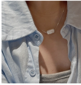 Close-up of S925 silver necklace featuring a rectangular mother of pearl pendant