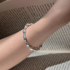 Minimalist S925 sterling silver beaded bracelet featuring polished oval and round metal beads