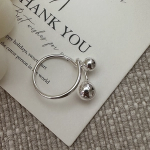 S925 sterling silver minimalist ring with dual polished bead pendants on gift card