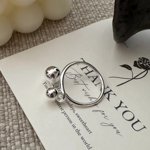 Minimalist S925 sterling silver open ring with double bead design on card background