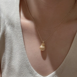 Minimalist S925 sterling silver golden lucky bag pendant necklace on model