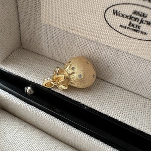 Minimalist S925 sterling silver gold fortune bag pendant with zircon and bow detail