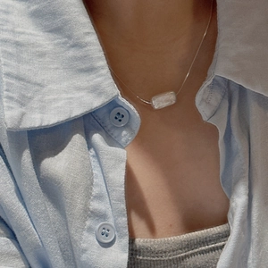 Minimalist S925 sterling silver necklace with a rectangular baroque pearl pendant on a model